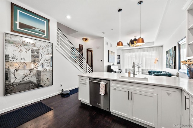 4150 Longview Ln, Boulder, CO 80301 - kitchen featuring a sink, stainless steel dishwasher, dark wood finished floors, white cabinetry, and a peninsula