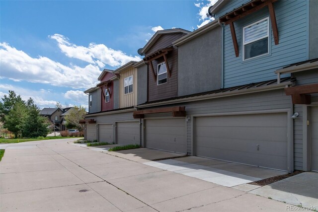 4150 Longview Ln, Boulder, CO 80301 - view of side of property with a garage, a standing seam roof, metal roof, and a residential view