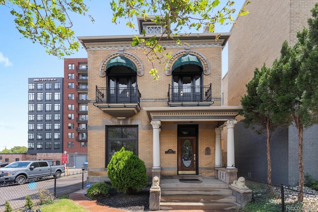 1650 N Pennsylvania St, Denver, CO 80203 - italianate home with a balcony and brick siding