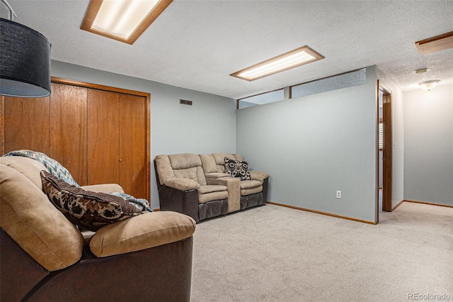 carpeted living area with visible vents, baseboards, and a textured ceiling