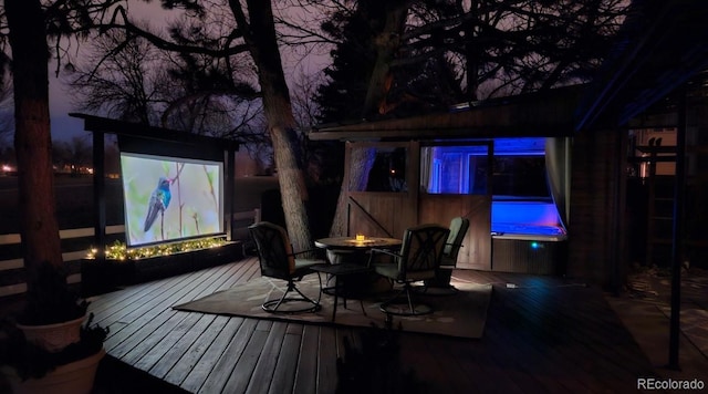 cinema room featuring wood finished floors