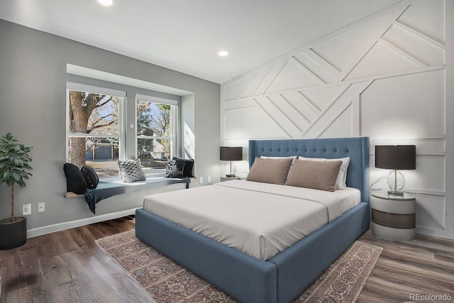 bedroom featuring recessed lighting, wood finished floors, and baseboards