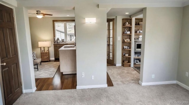 interior space with recessed lighting, baseboards, and dark carpet