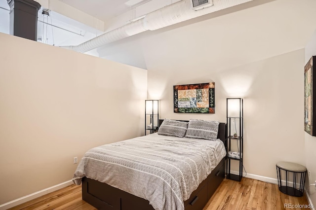 1555 California St Unit 304, Denver, CO 80202 - bedroom featuring light wood-type flooring and baseboards