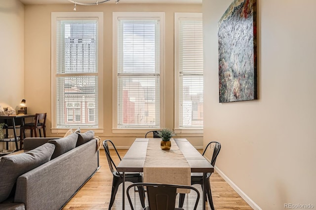 1555 California St Unit 304, Denver, CO 80202 - dining area with light wood-style flooring and baseboards