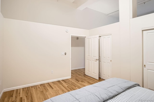 1555 California St Unit 304, Denver, CO 80202 - bedroom with wood finished floors, baseboards, and a closet