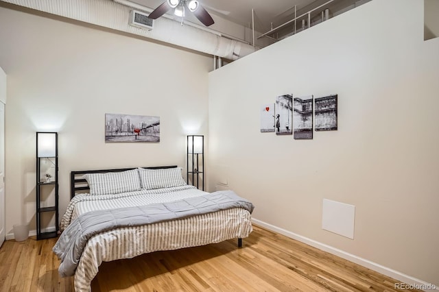 1555 California St Unit 304, Denver, CO 80202 - bedroom featuring wood finished floors, baseboards, and ceiling fan