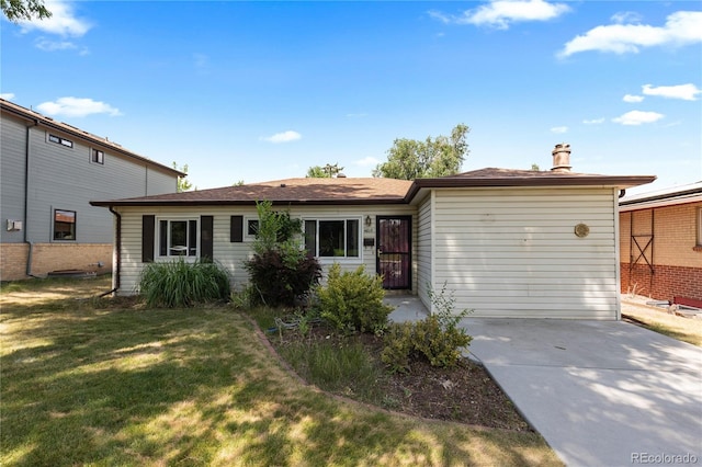 4815 S Pennsylvania St, Englewood, CO 80113 - view of front facade featuring driveway, a front lawn, and a chimney