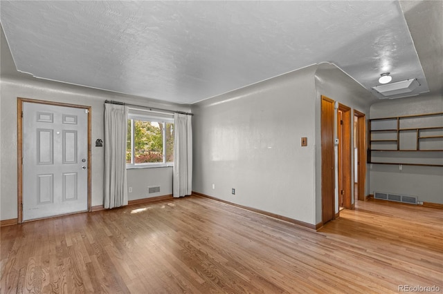 4815 S Pennsylvania St, Englewood, CO 80113 - foyer featuring light wood-style flooring and a textured ceiling
