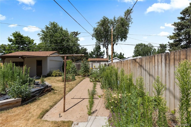 4815 S Pennsylvania St, Englewood, CO 80113 - view of yard featuring a garage and an outbuilding