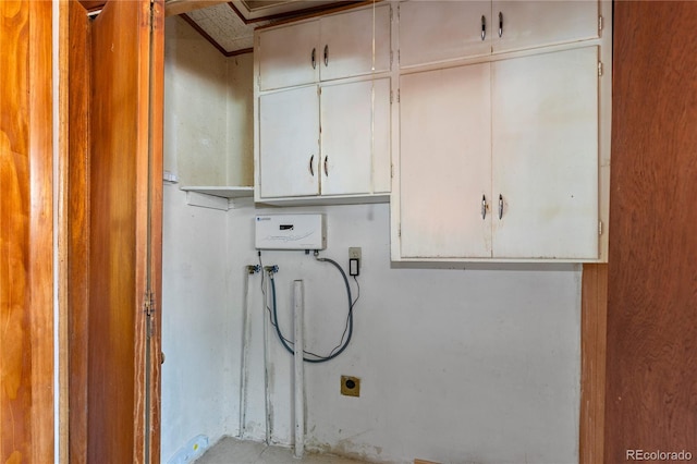 4815 S Pennsylvania St, Englewood, CO 80113 - laundry room featuring cabinet space, hookup for a washing machine, and electric dryer hookup