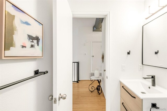 3069 Tejon St Unit B, Denver, CO 80211 - bathroom featuring vanity and wood finished floors