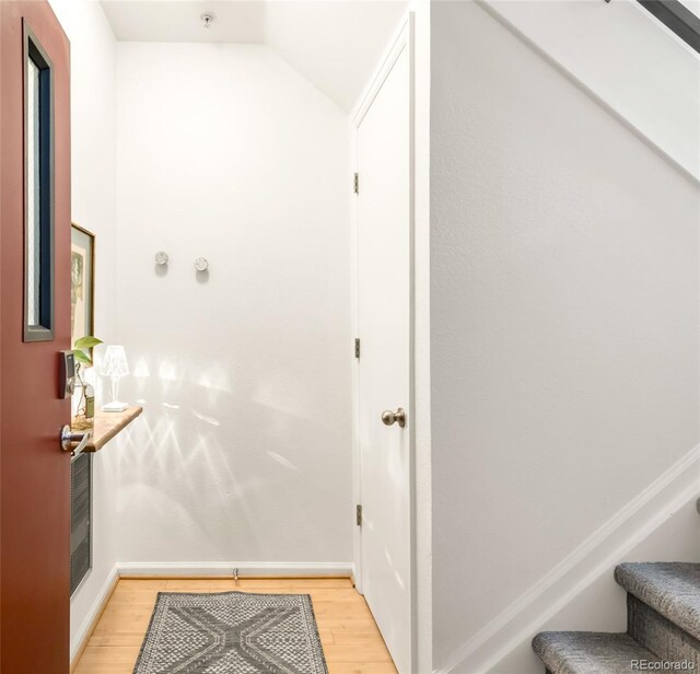 3069 Tejon St Unit B, Denver, CO 80211 - hallway with light wood-style floors, stairs, and vaulted ceiling