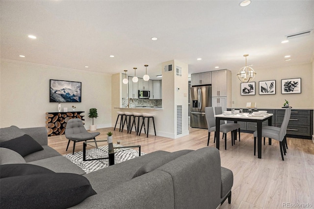 460 S Marion Pkwy Unit 604, Denver, CO 80209 - living room with light wood-style floors, recessed lighting, and a chandelier