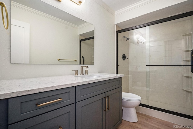 460 S Marion Pkwy Unit 604, Denver, CO 80209 - bathroom with ornamental molding, wood finished floors, a shower stall, and vanity