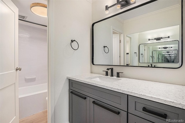 460 S Marion Pkwy Unit 604, Denver, CO 80209 - full bath featuring ornamental molding, vanity, wood finished floors, and shower / washtub combination