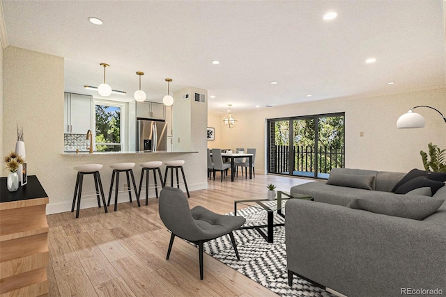 460 S Marion Pkwy Unit 604, Denver, CO 80209 - living room featuring recessed lighting and light wood-style flooring