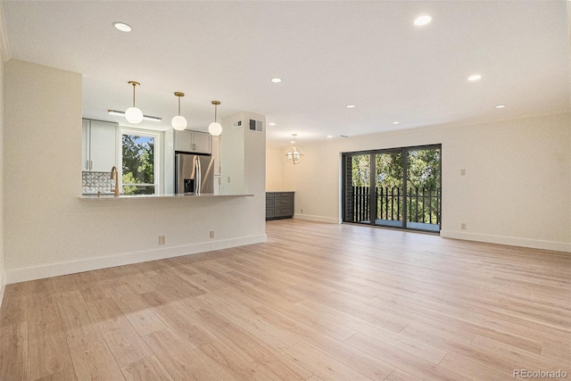 460 S Marion Pkwy Unit 604, Denver, CO 80209 - unfurnished living room with recessed lighting and light wood-style floors