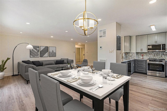 460 S Marion Pkwy Unit 604, Denver, CO 80209 - dining area featuring a chandelier, light wood-style floors, and recessed lighting