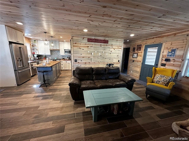 living room featuring recessed lighting, dark wood-style floors, wooden walls, and wooden ceiling