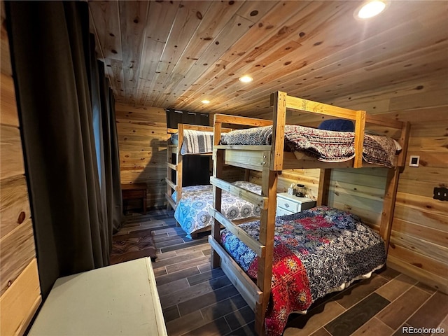 bedroom featuring recessed lighting, wood walls, wooden ceiling, and wood finish floors