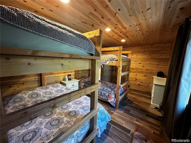 bedroom with recessed lighting, wood ceiling, wood walls, and wood tiled floor