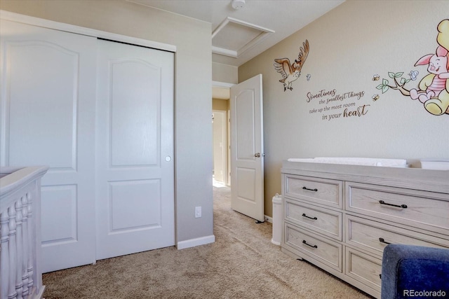 unfurnished bedroom with a closet and light carpet