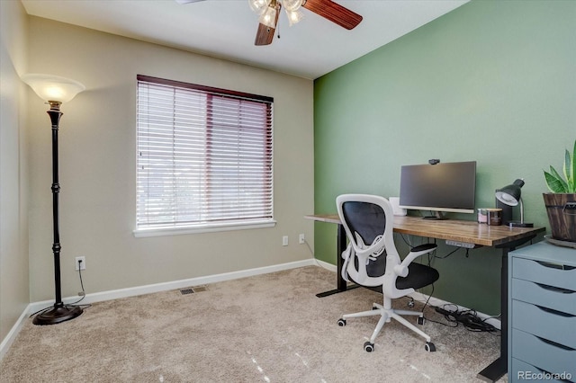 carpeted office with ceiling fan