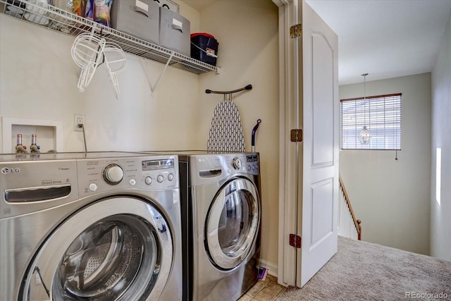 clothes washing area featuring washing machine and dryer