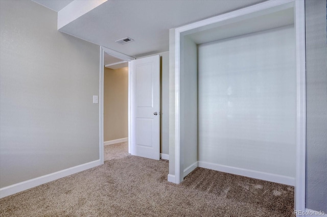 unfurnished bedroom featuring carpet