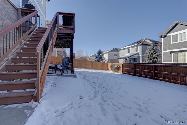 view of yard covered in snow