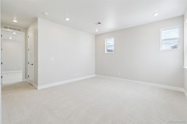 basement featuring light colored carpet