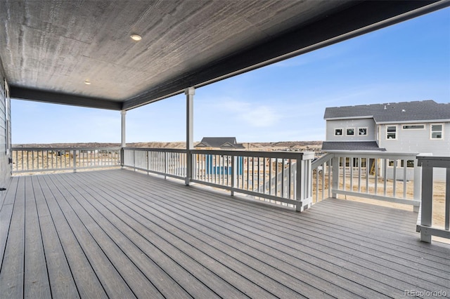 wooden deck featuring a pool