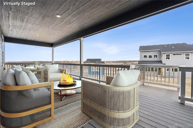 5566 Hickory Oaks Trl, Castle Rock, CO 80104 - wooden deck with an outdoor hangout area