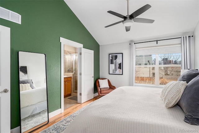 bedroom featuring visible vents, baseboards, ceiling fan, lofted ceiling, and light wood-style flooring