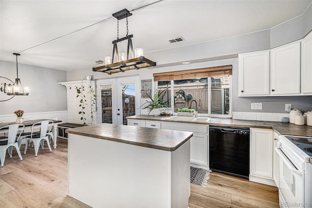 kitchen with dishwasher, white cabinets, french doors, and sink