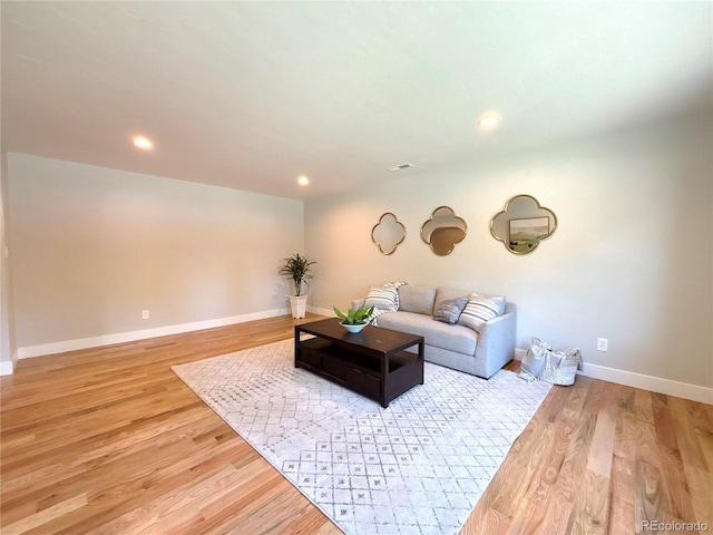 9451 E Evans Pl, Denver, CO 80231 - living room with light wood-type flooring and recessed lighting