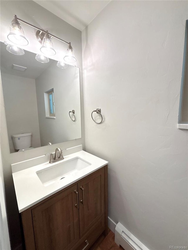 9451 E Evans Pl, Denver, CO 80231 - half bathroom featuring vanity and a baseboard radiator