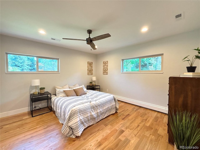 9451 E Evans Pl, Denver, CO 80231 - bedroom featuring a baseboard radiator, light wood-type flooring, ceiling fan, and recessed lighting