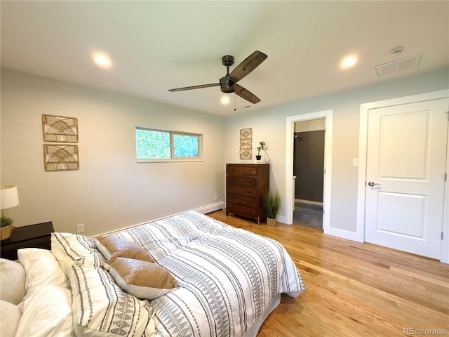 9451 E Evans Pl, Denver, CO 80231 - bedroom with light wood-type flooring, baseboard heating, recessed lighting, and a ceiling fan