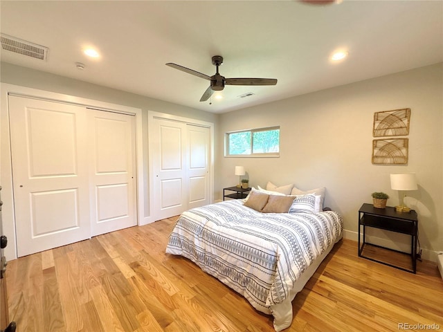 9451 E Evans Pl, Denver, CO 80231 - bedroom with multiple closets, light wood-type flooring, ceiling fan, and recessed lighting