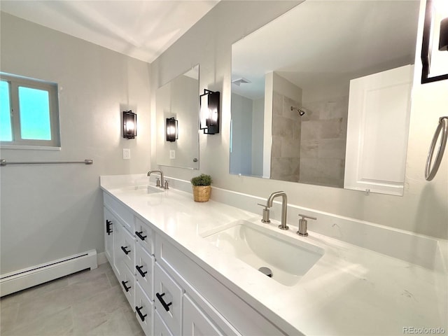 9451 E Evans Pl, Denver, CO 80231 - bathroom with a baseboard heating unit, double vanity, tiled shower, and tile patterned floors