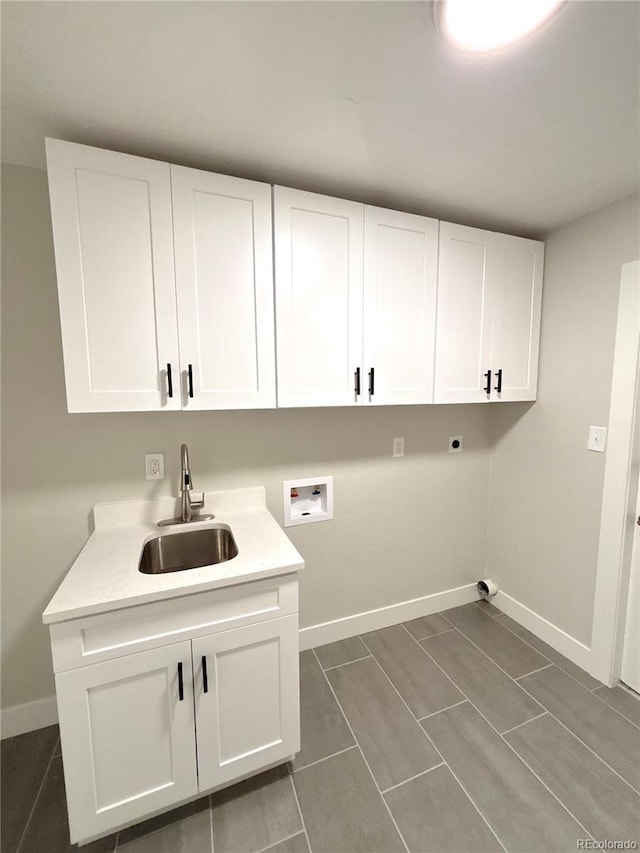9451 E Evans Pl, Denver, CO 80231 - laundry room with washer hookup, electric dryer hookup, and cabinet space