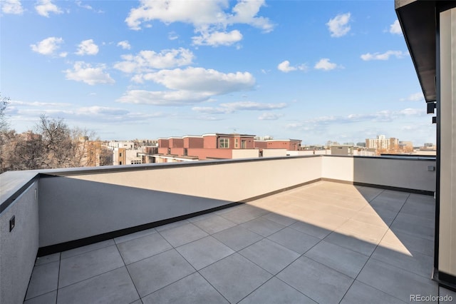 view of patio / terrace featuring a balcony and a city view