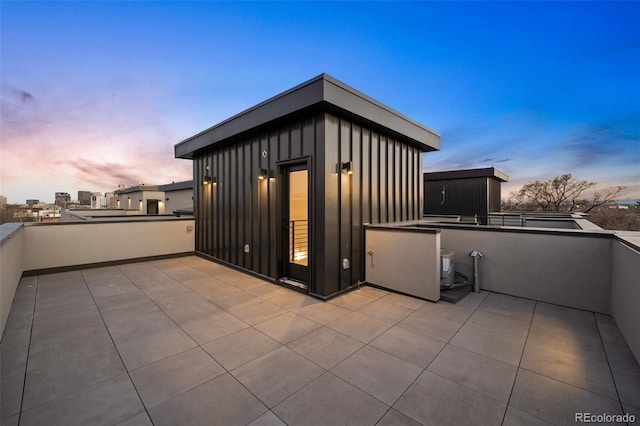 patio terrace at dusk with a balcony