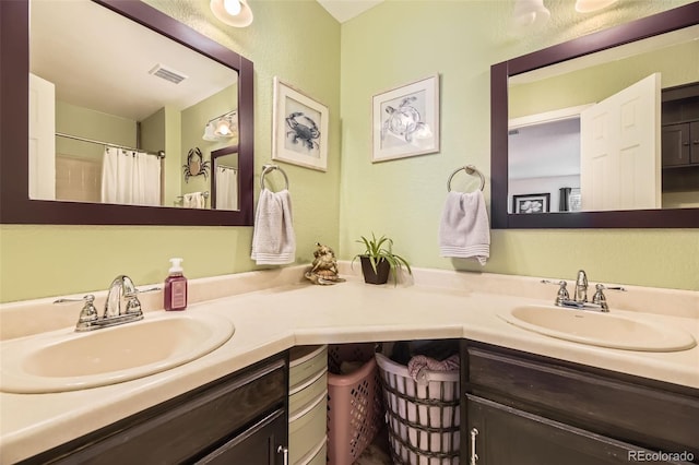 bathroom with vanity and curtained shower