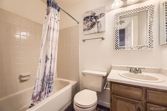 full bathroom with vanity, toilet, and shower / bath combo