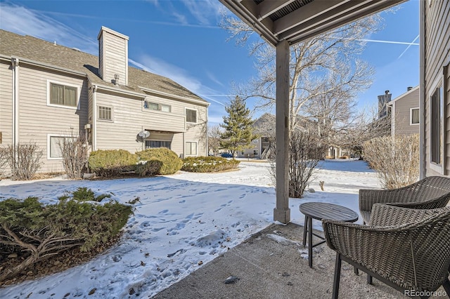 view of yard layered in snow