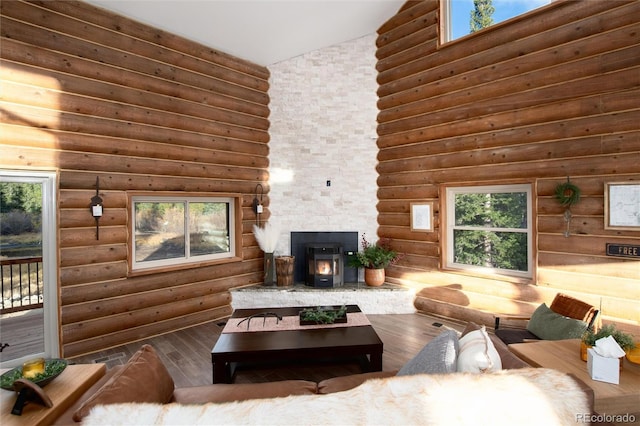 57 Overlook Ct, Idaho Springs, CO 80452 - living room with hardwood / wood-style floors, high vaulted ceiling, plenty of natural light, and rustic walls