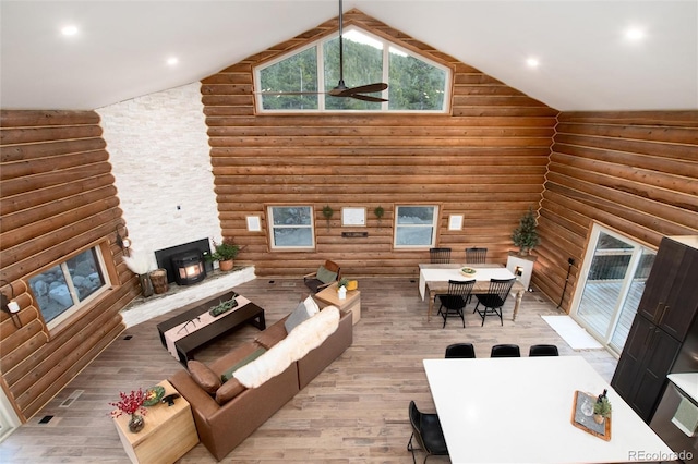 57 Overlook Ct, Idaho Springs, CO 80452 - living area featuring log walls, wood finished floors, high vaulted ceiling, ceiling fan, and recessed lighting